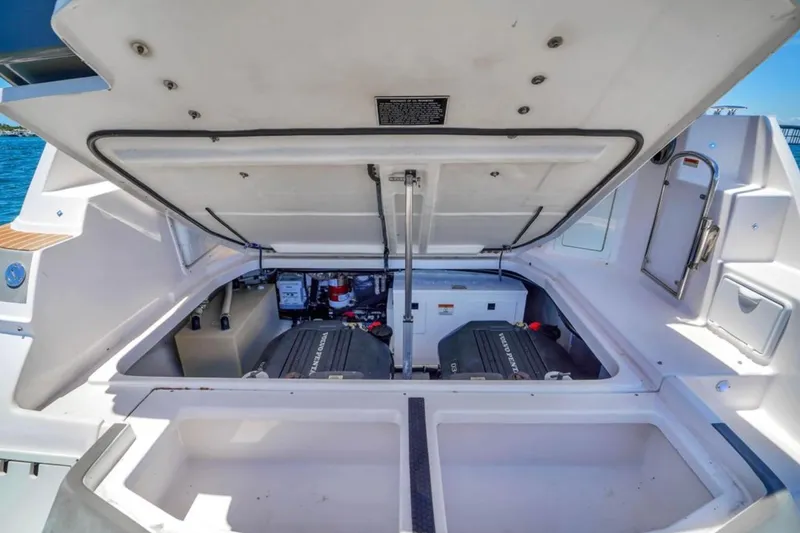 Slide: The Image of 2017 Regal 35 Sport Coupe engine compartment with open hatch, showcasing dual engines. - 14