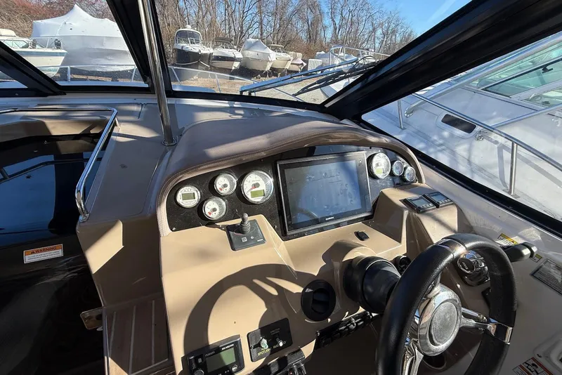 Slide: The Image of 2017 Regal 35 Sport Coupe dashboard with steering wheel and navigation display. - 2