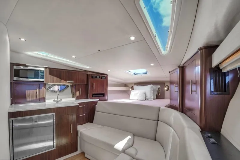 Slide: The Image of Luxurious interior of 2017 Regal 35 Sport Coupe with modern kitchen and cozy seating. - 5