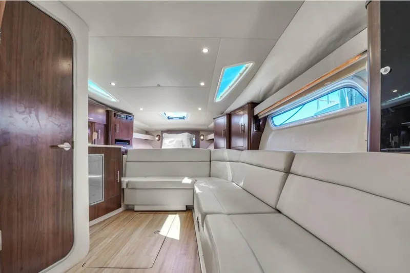 Slide: The Image of Interior of 2017 Regal 35 Sport Coupe with modern seating and wood accents. - 6