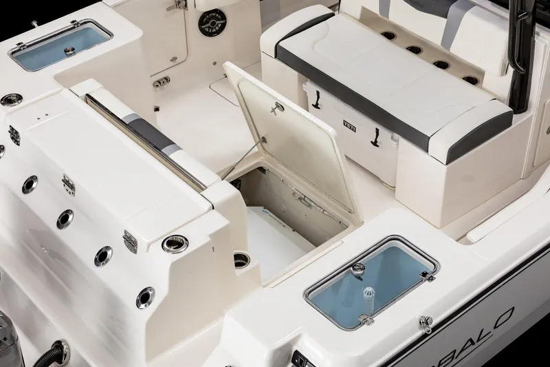 Slide: The Image of Manufacturer Provided Image: 2025 Robalo R300 Center Console boat interior with open storage compartments and seating. - 10