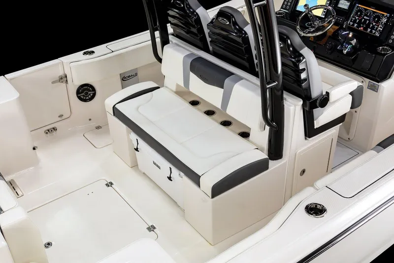 Slide: The Image of Manufacturer Provided Image: 2025 Robalo R300 Center Console boat interior with seating and control panel. - 11