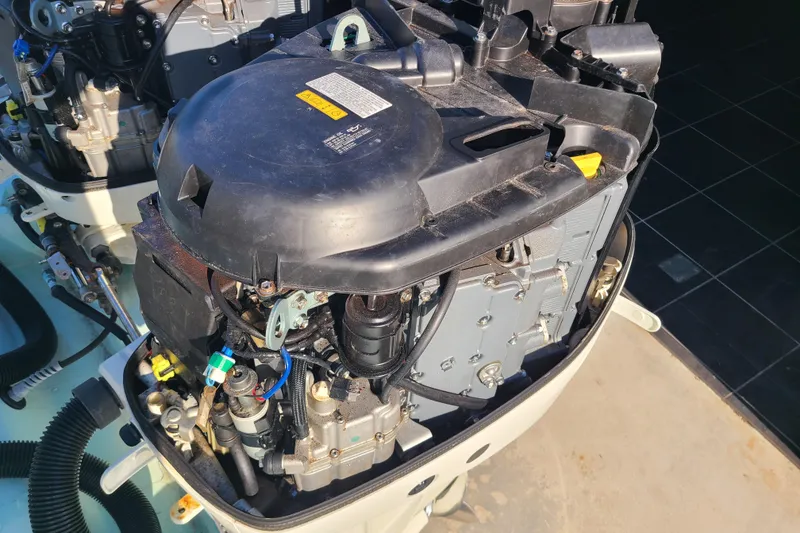 Slide: The Image of Open engine of a 2002 Scout 280 Sportfish boat, showcasing mechanical components. - 25