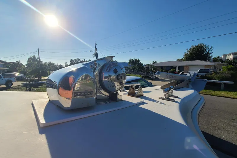 Slide: The Image of 2002 Scout 280 Sportfish boat deck with Lewmar winch under sunny sky. - 5