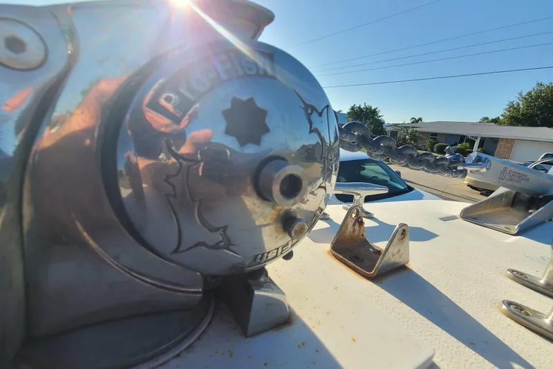 Slide: The Image of Close-up of a 2002 Scout 280 Sportfish boat's anchor winch in sunlight. - 6