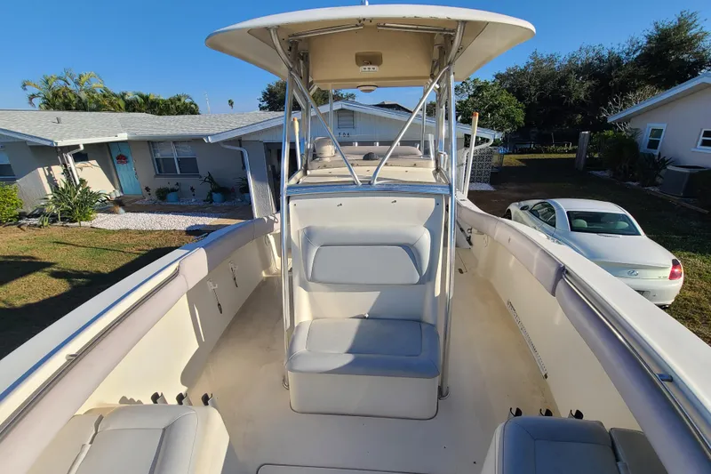 Slide: The Image of 2002 Scout 280 Sportfish boat with seating, parked in residential driveway. - 8