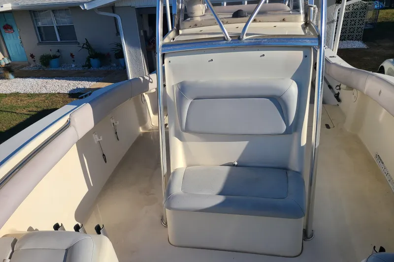 Slide: The Image of 2002 Scout 280 Sportfish boat interior with seating and railing. - 9