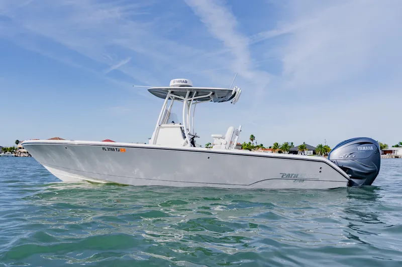 The Image of 2023 Pathfinder 2700 Open boat on water, featuring Yamaha engine, clear sky background. - 0