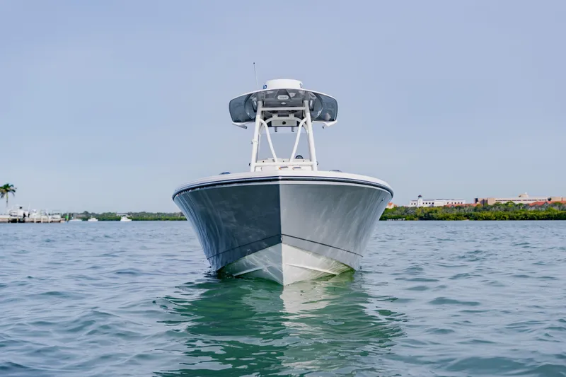 Slide: The Image of 2023 Pathfinder 2700 Open boat on calm water, front view. - 1
