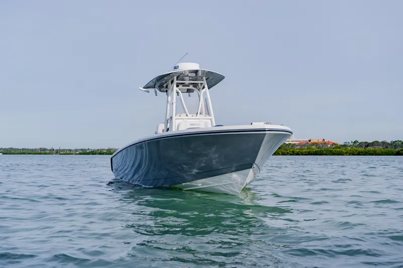 Slide: The Image of 2023 Pathfinder 2700 Open boat on calm water, showcasing sleek design. - 10