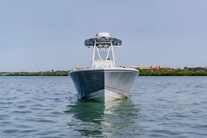 Slide: The Image of 2023 Pathfinder 2700 Open boat on calm water, front view. - 13
