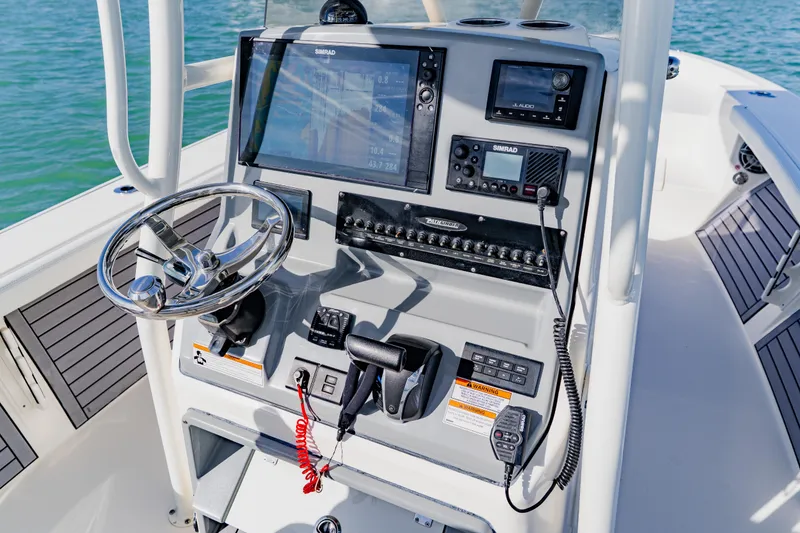 Slide: The Image of 2023 Pathfinder 2700 Open boat console with steering wheel and navigation equipment. - 23