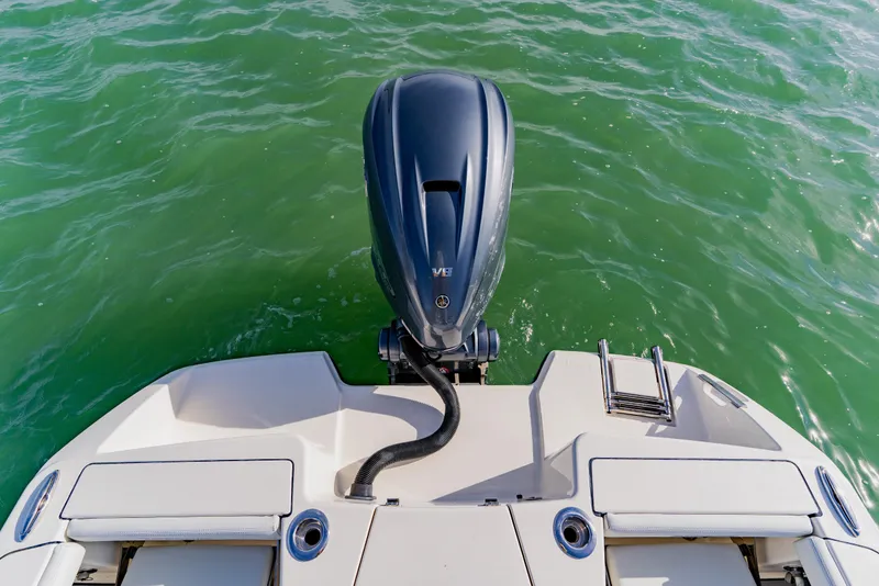 Slide: The Image of 2023 Pathfinder 2700 Open boat with outboard motor on green water. - 26