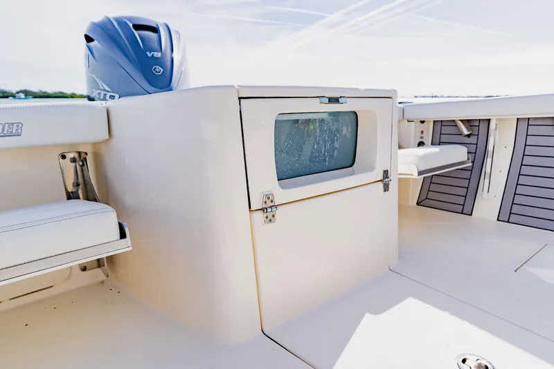 Slide: The Image of 2023 Pathfinder 2700 Open boat interior with Yamaha V8 engine, featuring seating and storage. - 28