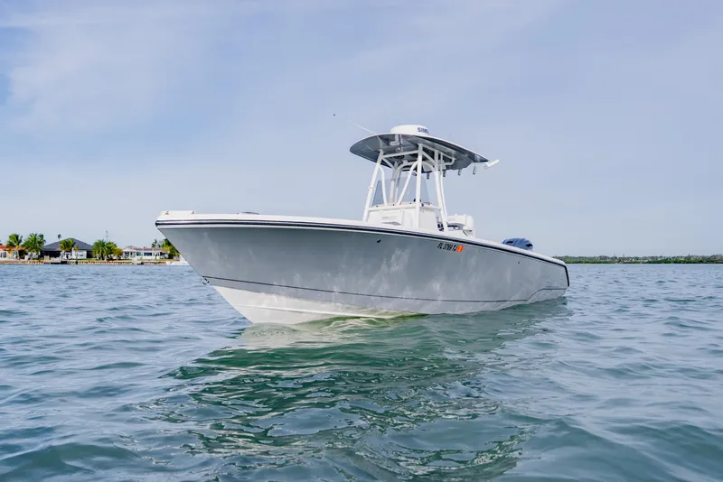 Slide: The Image of 2023 Pathfinder 2700 Open boat on calm water, showcasing sleek design and modern features. - 3