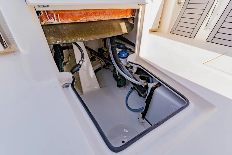 Slide: The Image of 2023 Pathfinder 2700 Open boat compartment with visible wiring and components. - 34