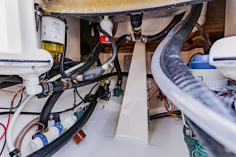 Slide: The Image of 2023 Pathfinder 2700 Open boat engine compartment with hoses and filters. - 35