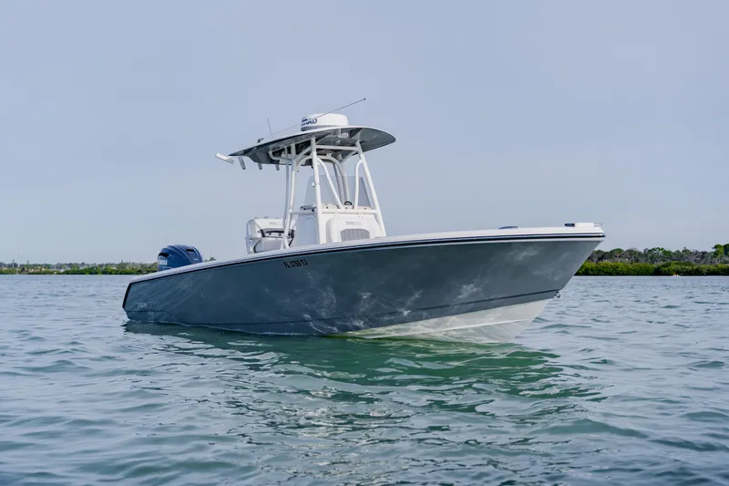 Slide: The Image of 2023 Pathfinder 2700 Open boat on calm water, showcasing sleek design and modern features. - 9