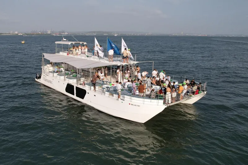 The Image of Large catamaran boat "PAXCAT" 2027 with passengers enjoying a sunny day on the water. - 0