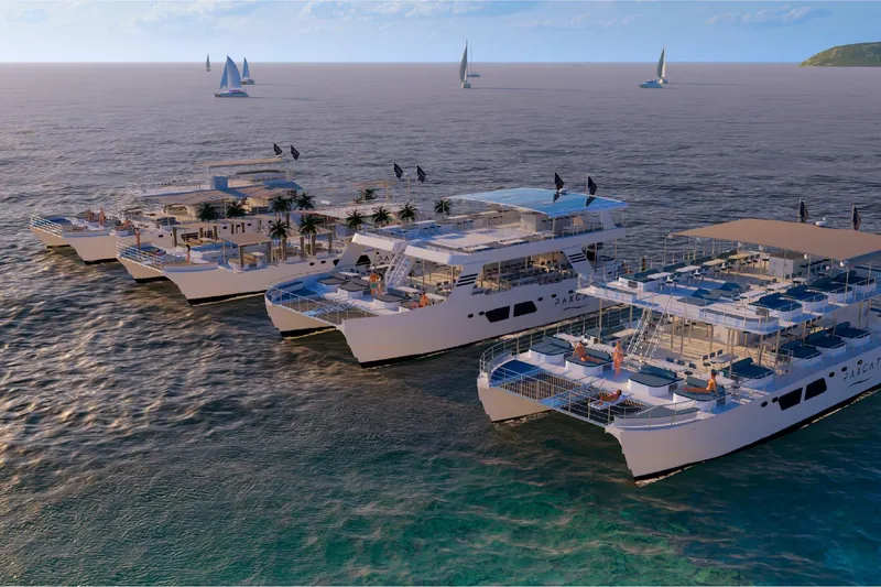 Slide: The Image of Custom PAXCAT 2027 catamarans sailing with luxury amenities and sunbathing decks. - 13
