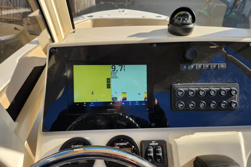 Slide: The Image of Yamaha tachometer display on 2024 Scout 215 XSF boat, showing 98.9 hours. - 10