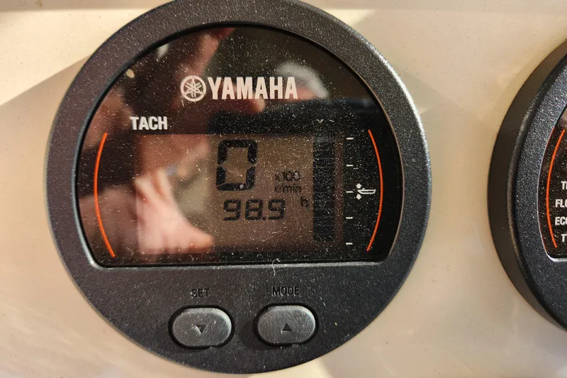 Slide: The Image of 2024 Scout 215 XSF dashboard with Yamaha gauges and Lenco controls. - 11