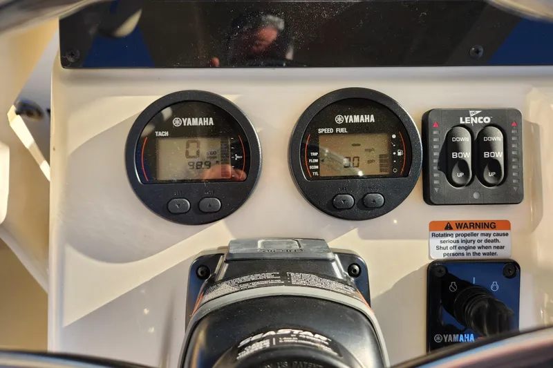 Slide: The Image of 2024 Scout 215 XSF boat dashboard with Yamaha ignition and keychain. - 12