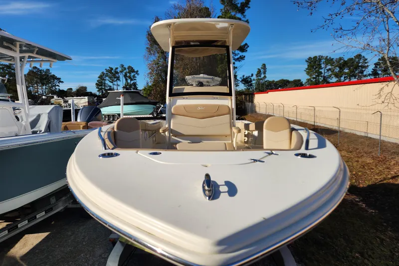 Slide: The Image of 2024 Scout 215 XSF boat console with logo detail. - 2