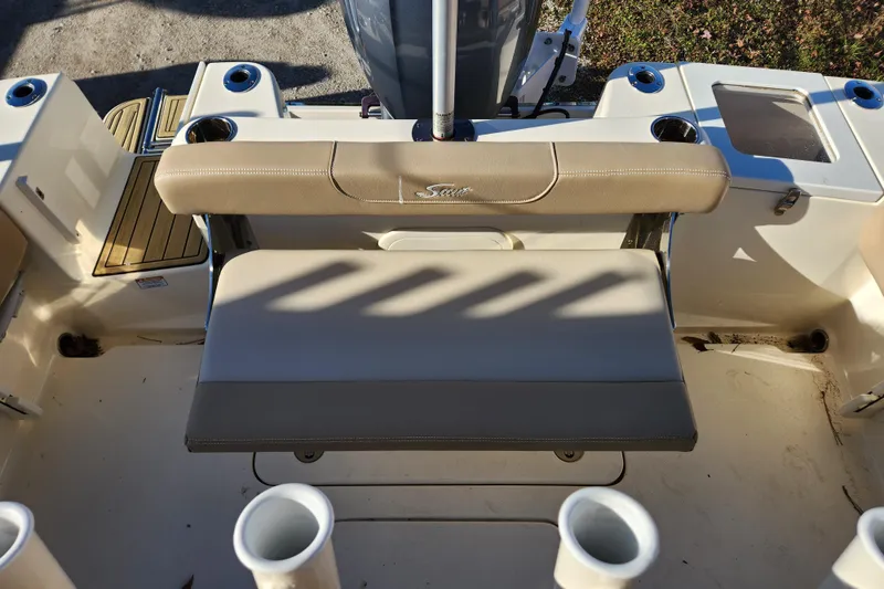 Slide: The Image of 2024 Scout 215 XSF boat interior with open storage compartments. - 20