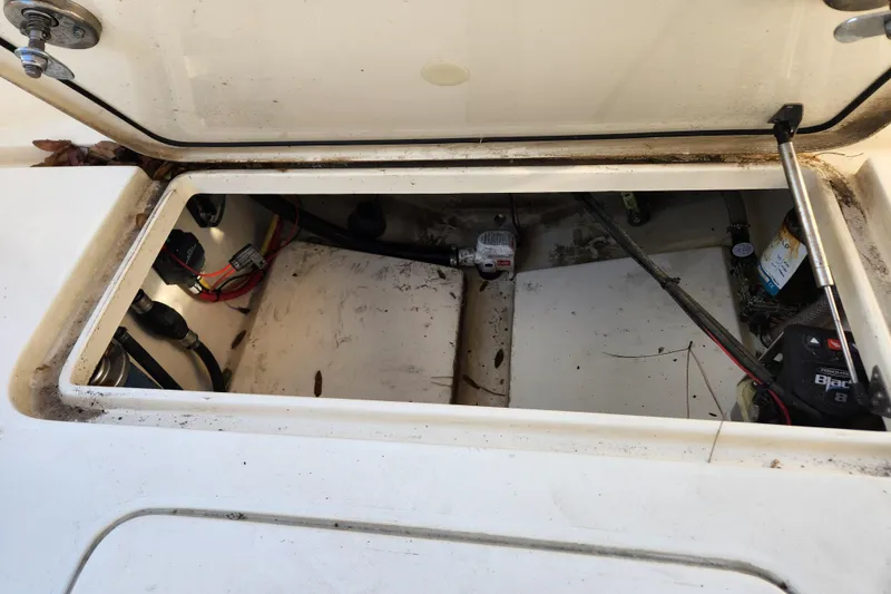 Slide: The Image of 2024 Scout 215 XSF boat anchor compartment with open hatch. - 22