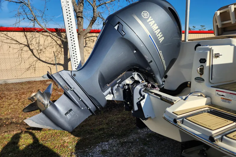 Slide: The Image of 2024 Scout 215 XSF boat with Yamaha outboard motor in showroom. - 5