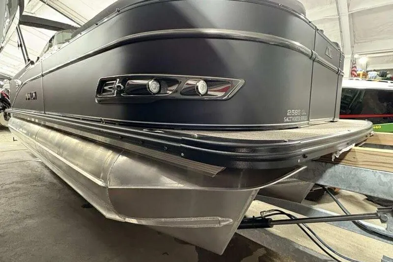 The Image of 2026 Avalon 2585 CAT QL pontoon boat in a showroom, showcasing sleek design and modern features. - 0