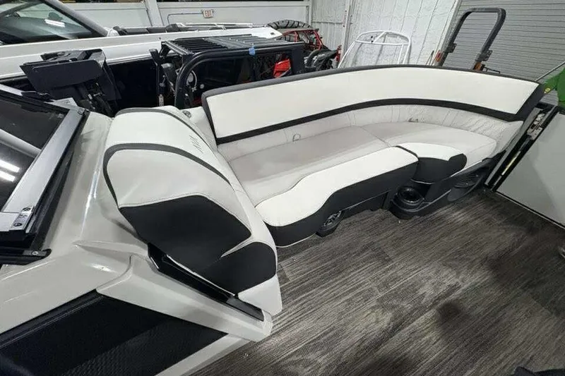 Slide: The Image of 2026 Avalon 2585 CAT QL boat interior with sleek white and black seating. - 15