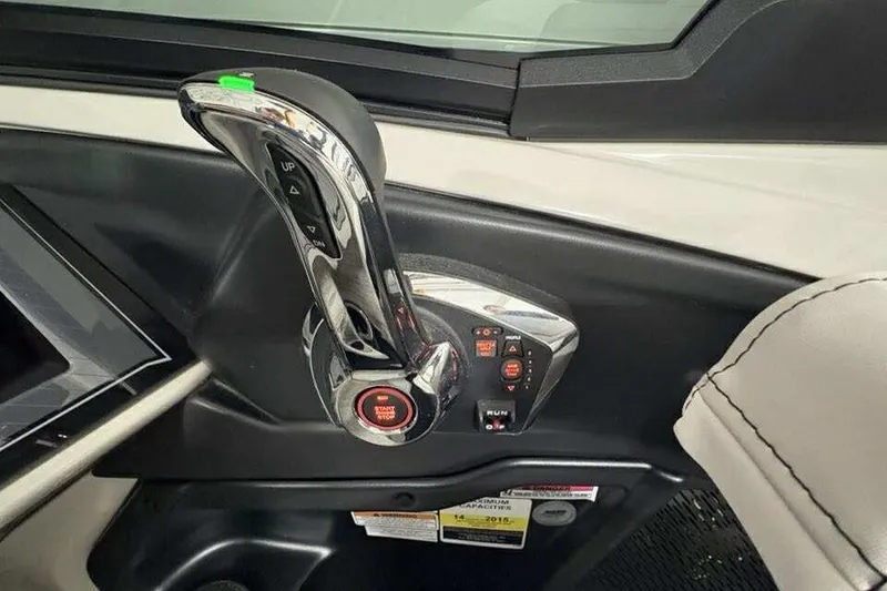 Slide: The Image of 2026 Avalon 2585 CAT QL boat throttle control with start/stop button and stitched upholstery. - 16