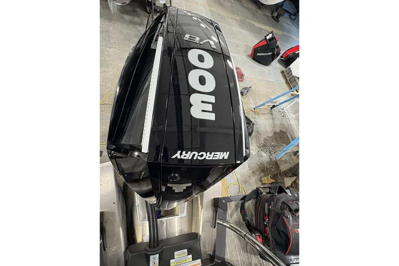 Slide: The Image of 2026 Avalon 2585 CAT QL with Mercury 300 outboard engine in workshop setting. - 20