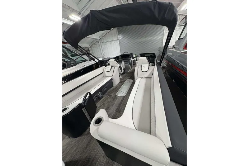 Slide: The Image of 2026 Avalon 2585 CAT QL pontoon boat interior with sleek seating and canopy. - 6