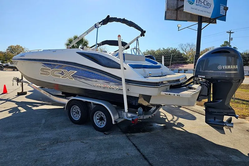 Slide: The Image of 2017 Starcraft Crossover 231 SCX OB boat on trailer with Yamaha outboard motor. - 3