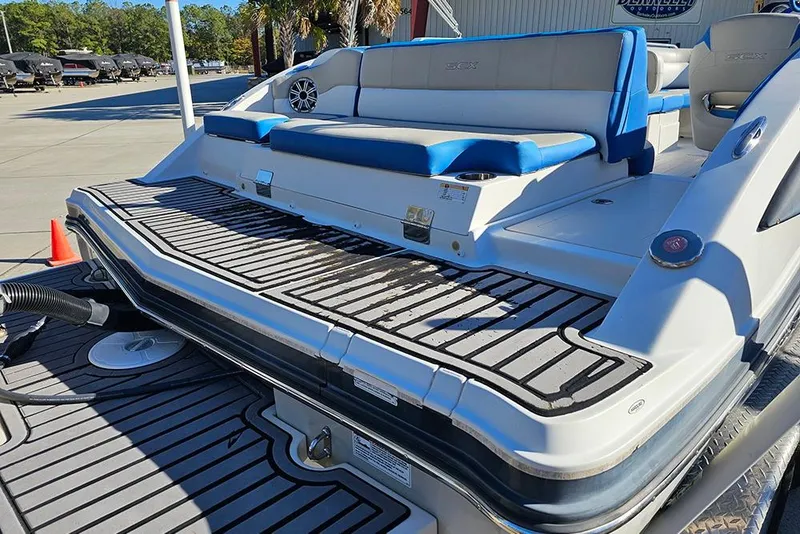 Slide: The Image of 2017 Starcraft Crossover 231 SCX OB boat with blue seating and spacious deck. - 8