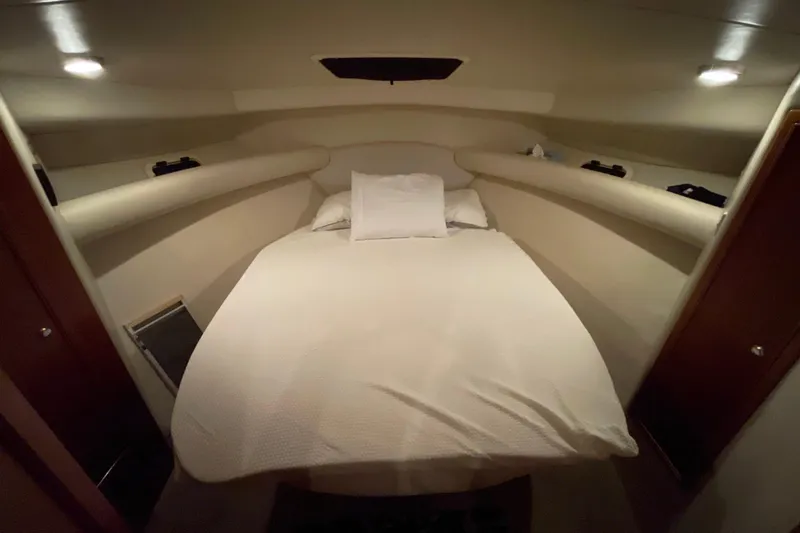 Slide: The Image of 2002 Riviera 34 Convertible yacht interior kitchen with modern amenities. - 13