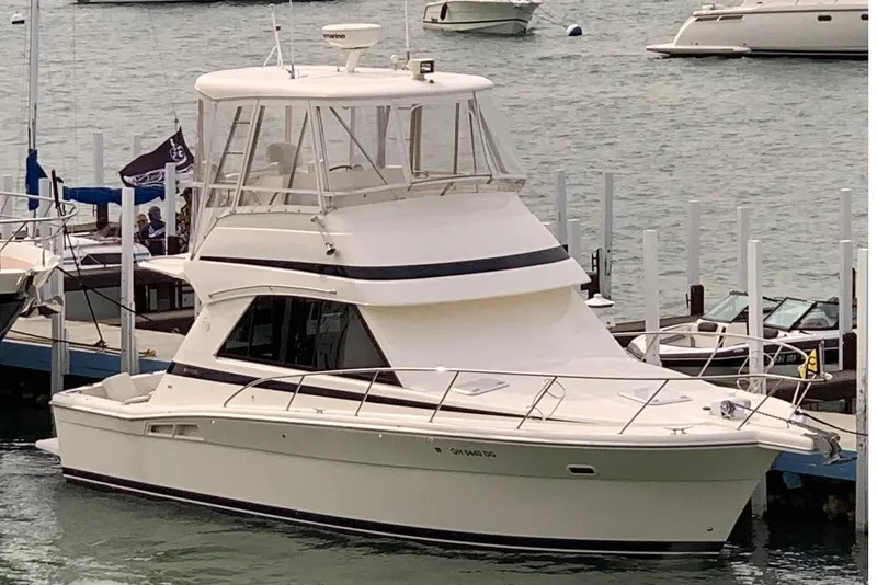 Slide: The Image of 2002 Riviera 34 Convertible yacht interior with ladder and open door. - 2