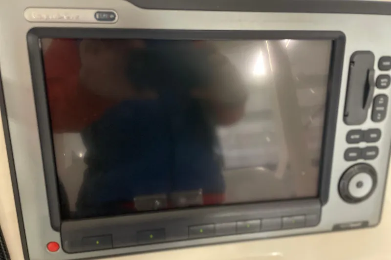 Slide: The Image of Control panel of 2002 Riviera 34 Convertible boat with gauges and switches. - 27