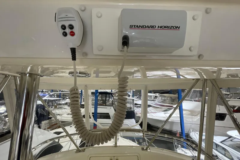 Slide: The Image of Control panel of a 2002 Riviera 34 Convertible boat with gauges and switches. - 28