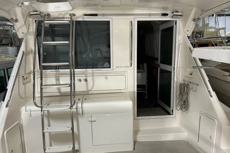 Slide: The Image of Interior view of a 2002 Riviera 34 Convertible boat with Standard Horizon radio equipment. - 30