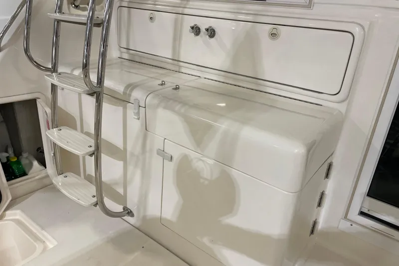 Slide: The Image of Interior view of a 2002 Riviera 34 Convertible yacht, featuring a control panel. - 31