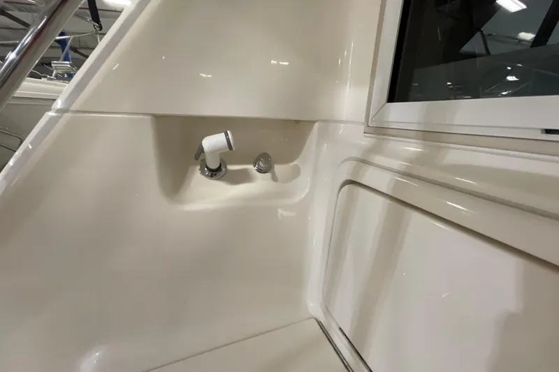 Slide: The Image of 2002 Riviera 34 Convertible yacht interior with ladder and storage compartments. - 32