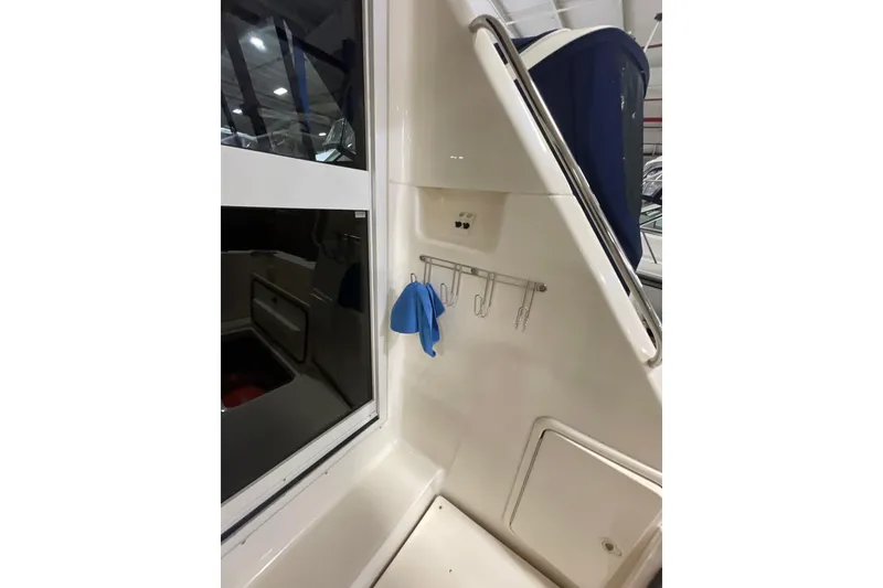 Slide: The Image of 2002 Riviera 34 Convertible boat interior detail with faucet and window. - 33