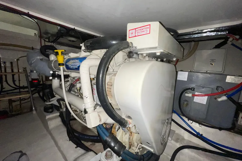 Slide: The Image of Engine room of a 2002 Riviera 34 Convertible boat, showcasing mechanical components. - 47