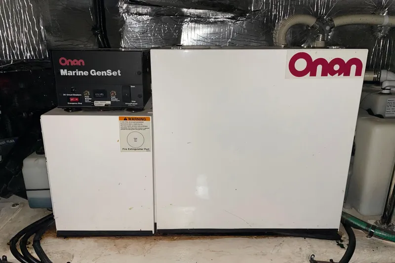 Slide: The Image of Onan Marine GenSet in 2002 Riviera 34 Convertible engine room. - 49