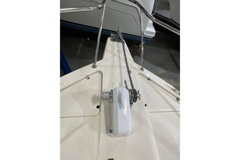 Slide: The Image of Bow of 2002 Riviera 34 Convertible with anchor chain and windlass system. - 60