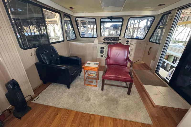 Slide: The Image of Interior salon space with leather chairs and helm. - 42